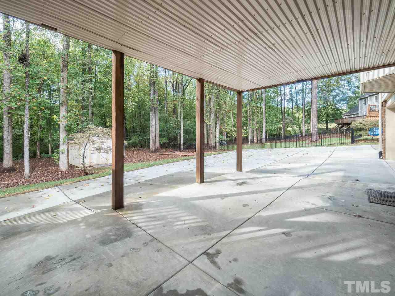 7705 Valley Run Drive Raleigh, NC 27615 - Photo 22 of 27 a house with trees in front of it