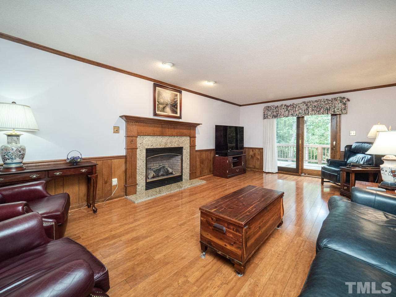 7705 Valley Run Drive Raleigh, NC 27615 - Photo 8 of 27 a living room with furniture and a fireplace