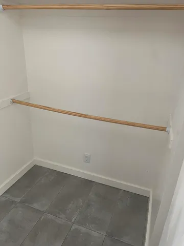 a view of balcony with wooden floor