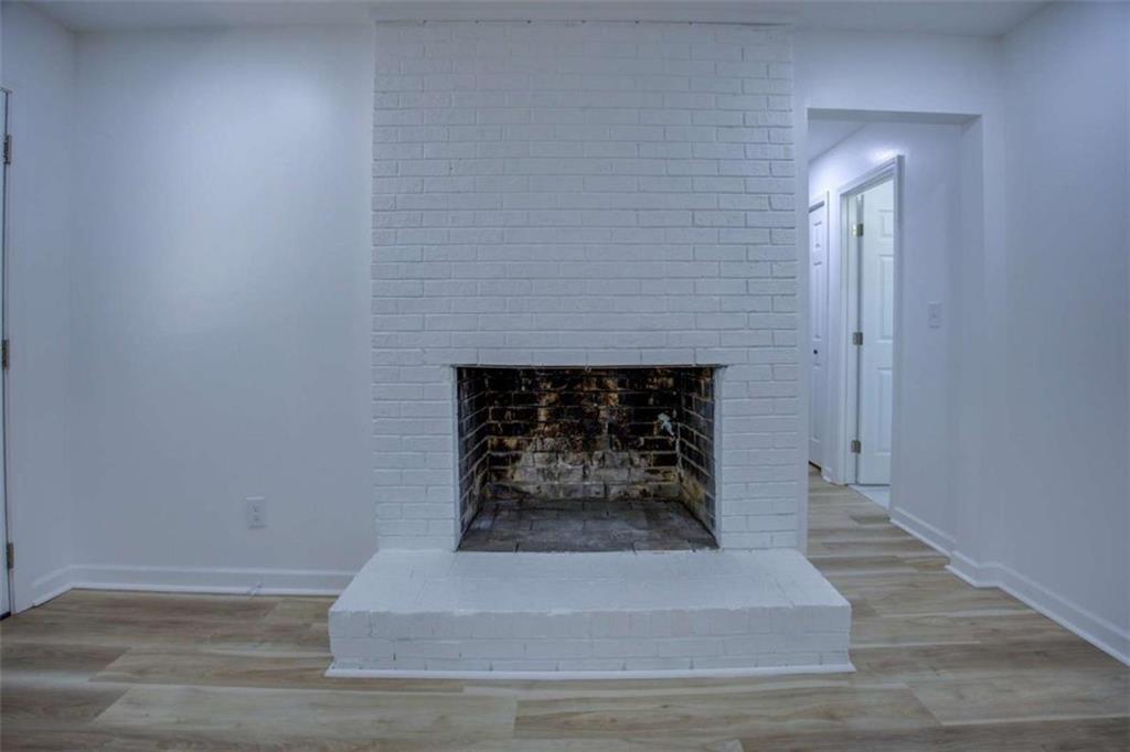 7225 Pineneedle Drive Southwest Covington, GA 30014 - Photo 7 of 37 a living room with a fireplace