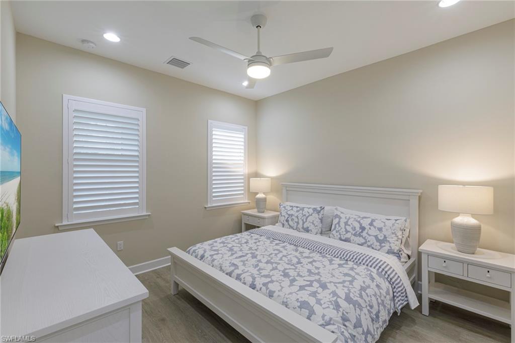 7184 Cayo Coco Lane Naples, FL 34113 - Photo 11 of 40 a bedroom with a bed and a window