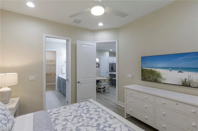 a spacious bathroom with a granite countertop sink and a mirror