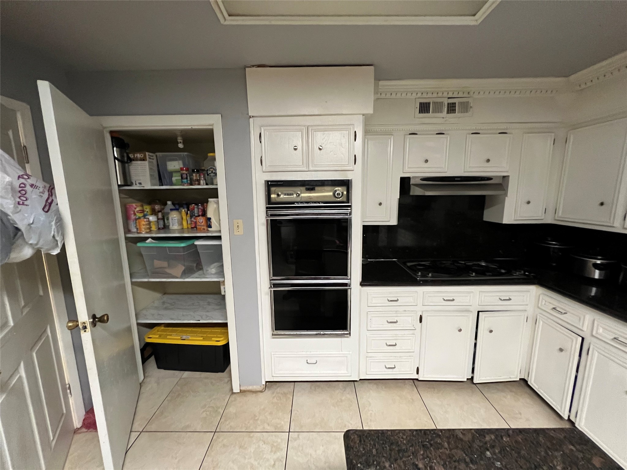 1102 75th Street Houston, TX 77012 - Photo 11 of 43 a kitchen with a white cabinets and appliances