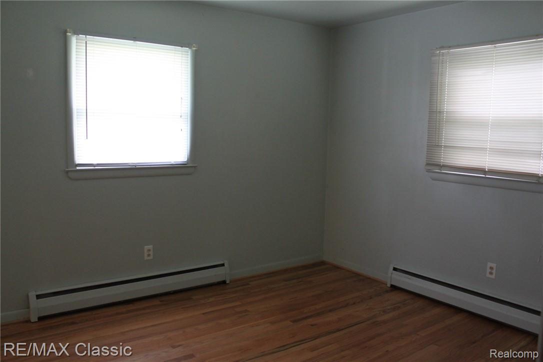 7923 Jennings Road Whitmore Lake, MI 48189 - Photo 8 of 9 Master Bedroom w/Hardwood Floors & Attached 1/2 Bath