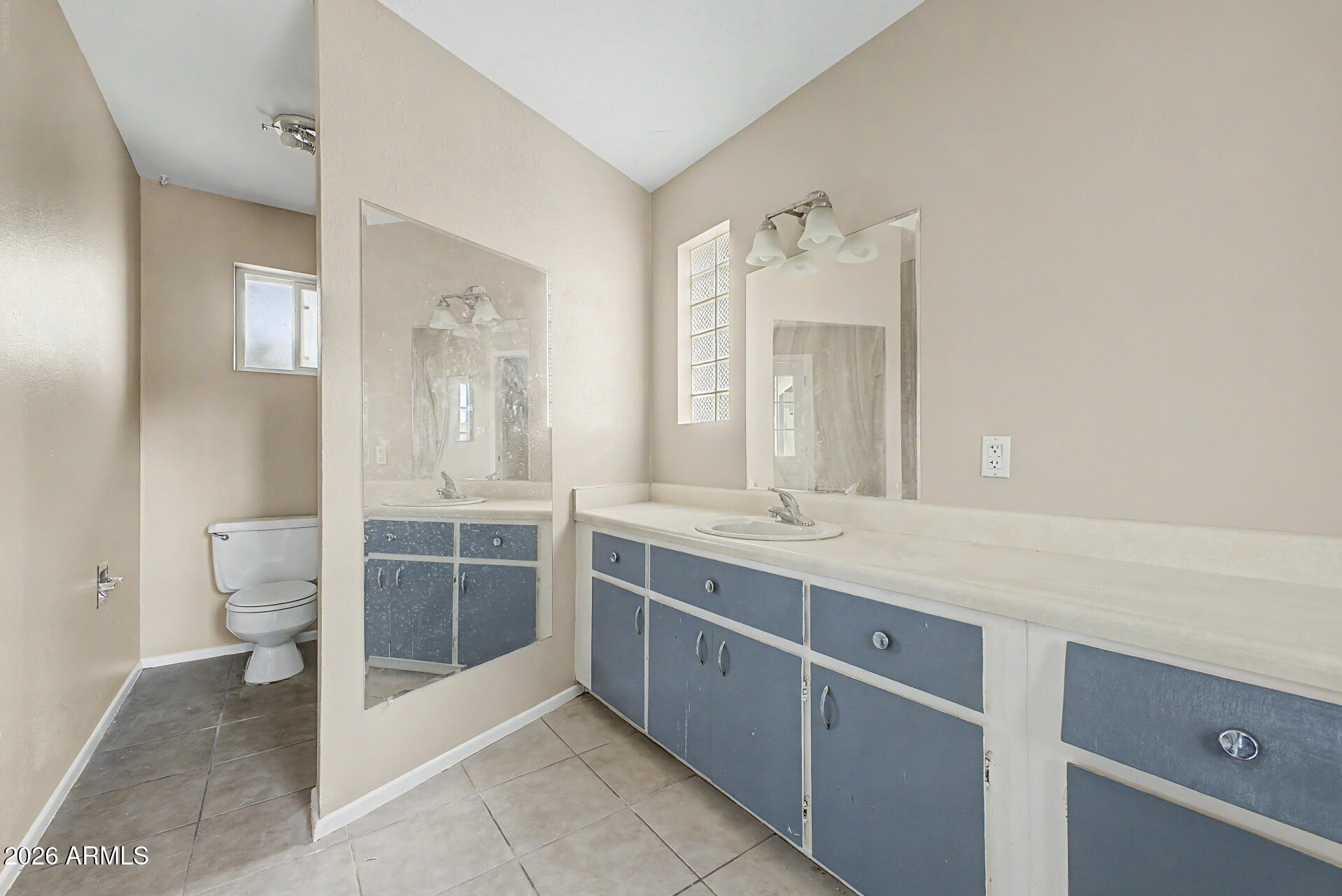 4007 West Mountain View Road Phoenix, AZ 85051 - Photo 20 of 31 a spacious bathroom with a granite countertop sink mirror and toilet