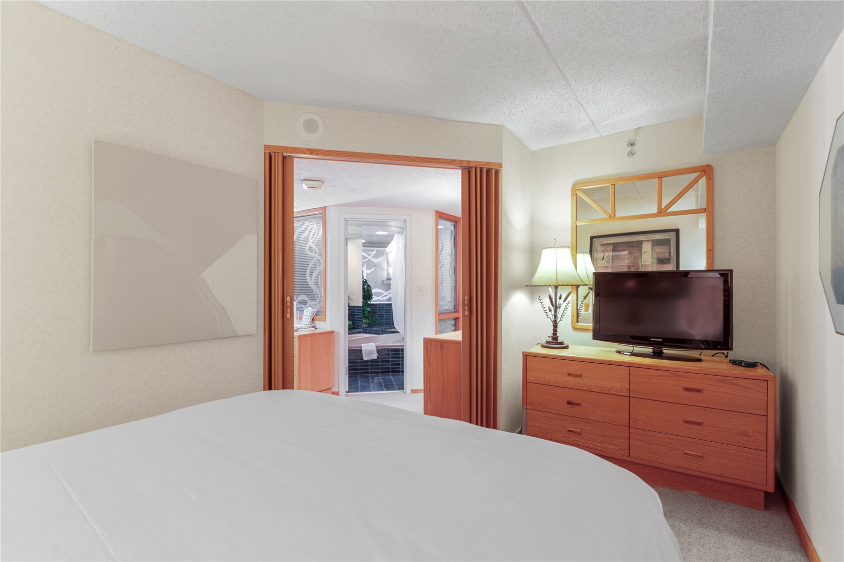 640 Village Road, Unit 4516 Breckenridge, CO 80424 - Photo 10 of 18 Bedroom with light colored carpet and a textured ceiling