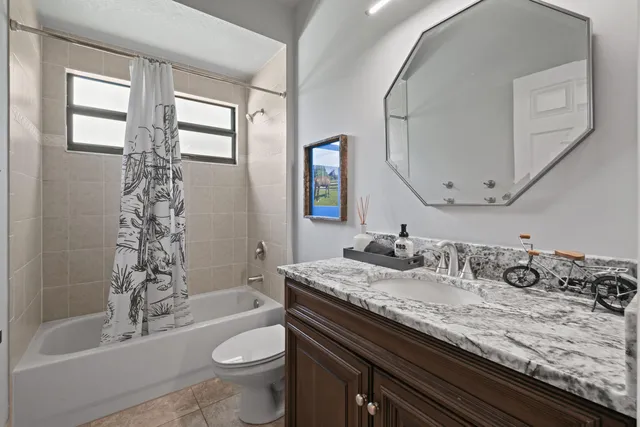 a bed room with a bed and a window