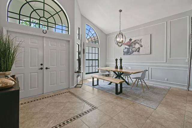 a view of a dining room with furniture window and outside view