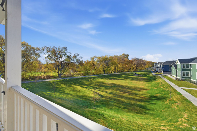 1038 South Old Towne Road Layton, UT 84041 - Photo 33 of 39 Expansive green space featuring mature trees and a paved pathway