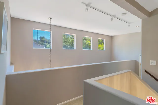 a room with window and ceiling fan