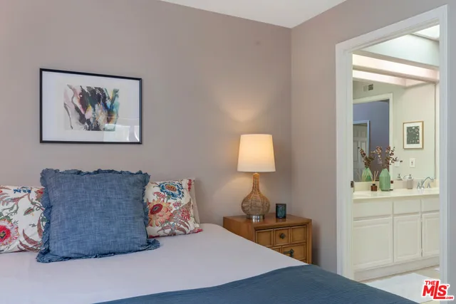 a bedroom with furniture and a bed