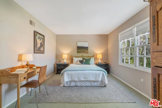 a view of a house with backyard porch and sitting area