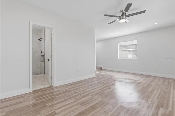 a view of an empty room with a window