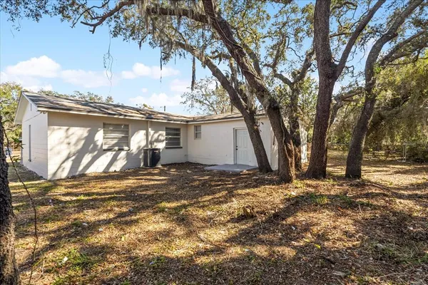 a view of a house with snow on the tree