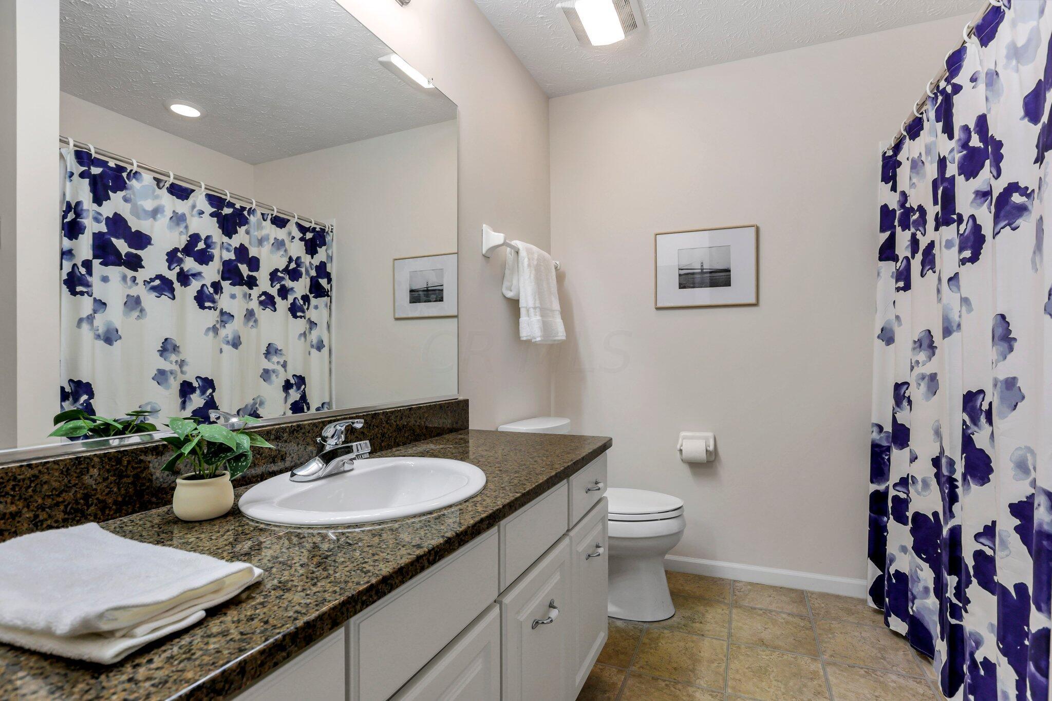 4223 Cobbler Road, Unit 16422 New Albany, OH 43054 - Photo 21 of 36 2nd full bathroom with shower/tub combo, granite counters, and linen closet.