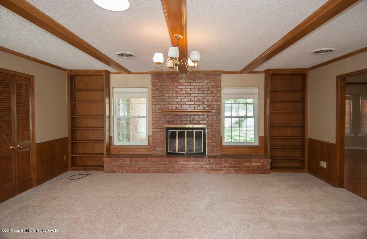 3306 Lombard Road Amarillo, TX 79106 - Photo 4 of 23 wooden floor and windows in an empty room