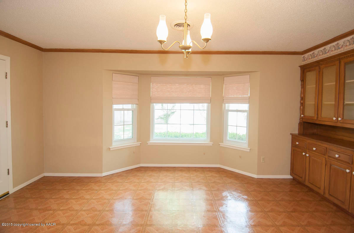 3306 Lombard Road Amarillo, TX 79106 - Photo 10 of 23 a view of an empty room with a window
