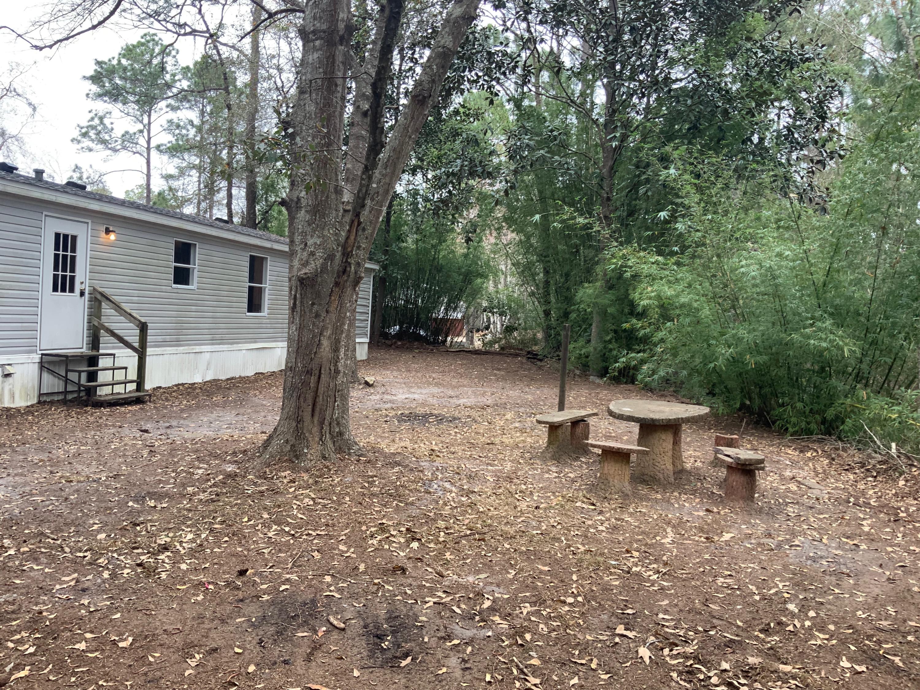 126 South 3rd Street Santa Rosa Beach, FL 32459 - Photo 2 of 12 a view of a house with a yard and sitting area