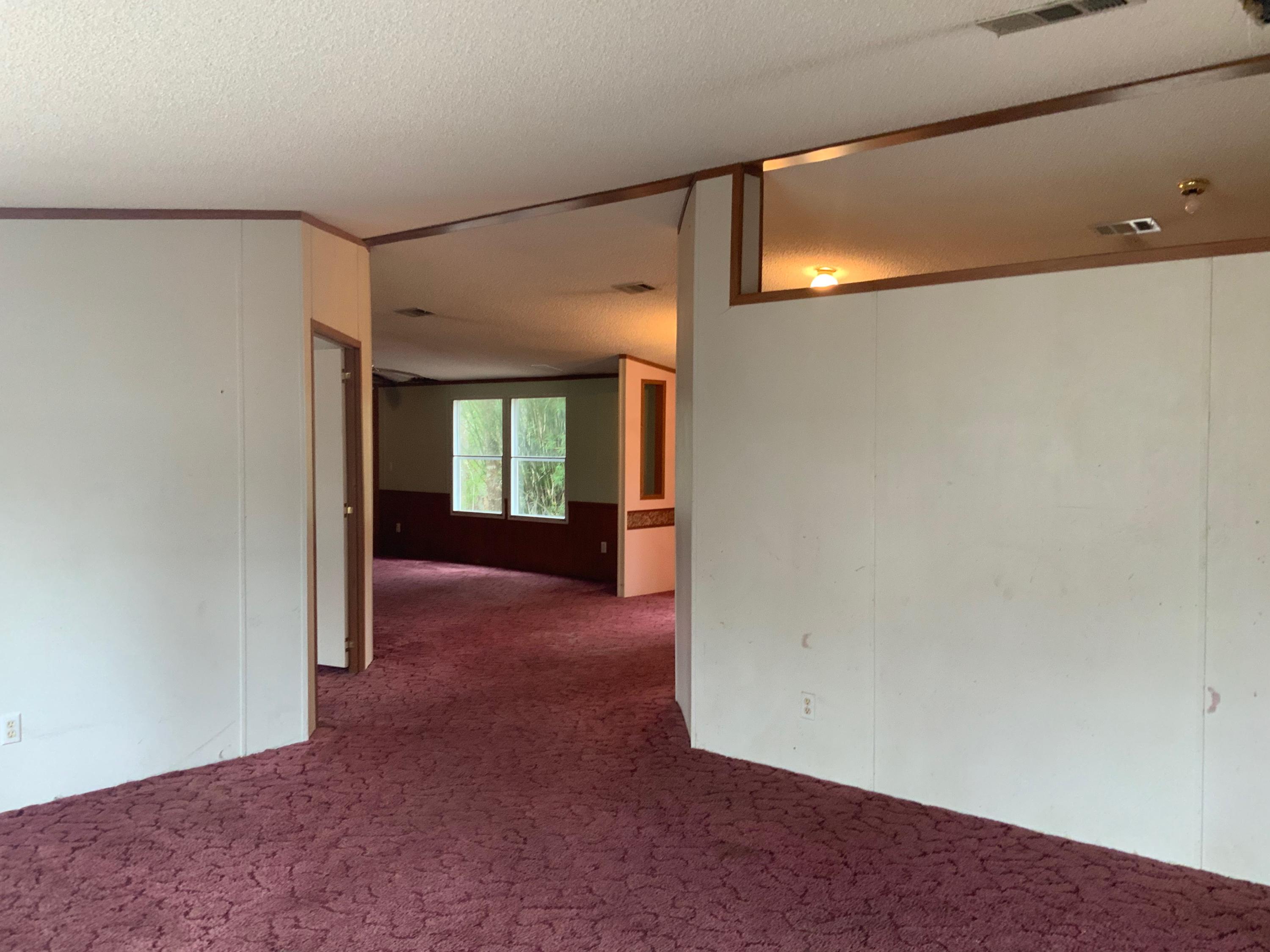 126 South 3rd Street Santa Rosa Beach, FL 32459 - Photo 7 of 12 a view of a big room with wooden floor and windows