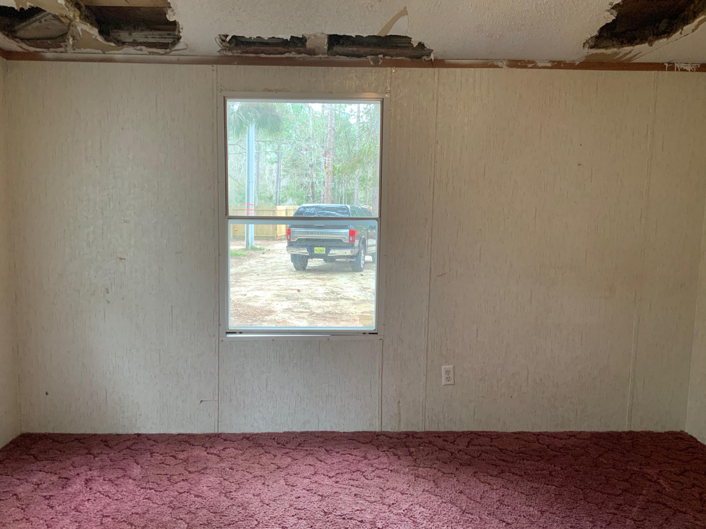 126 South 3rd Street Santa Rosa Beach, FL 32459 - Photo 10 of 12 a view of an empty room and window