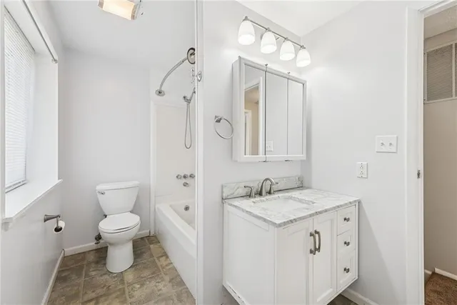 a view of empty room with white walls