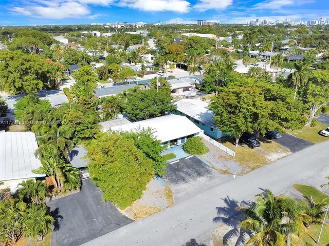 an aerial view of residential houses with outdoor space