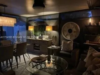 a kitchen with dining table and chairs