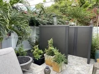 a view of a backyard with plants and garden