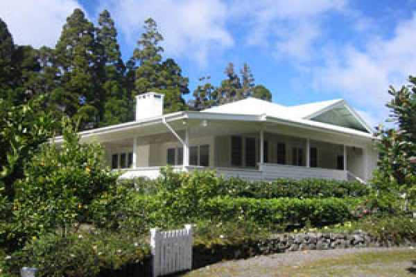 19-4023 Old Volcano Road Volcano, HI 96785 - Photo 1 of 17 a front view of a house with a garden