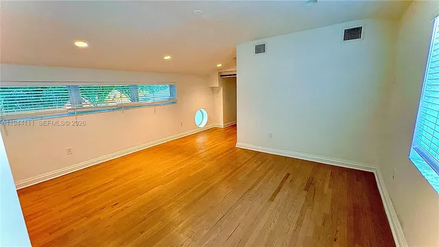 a view of a house with backyard sitting area and garden