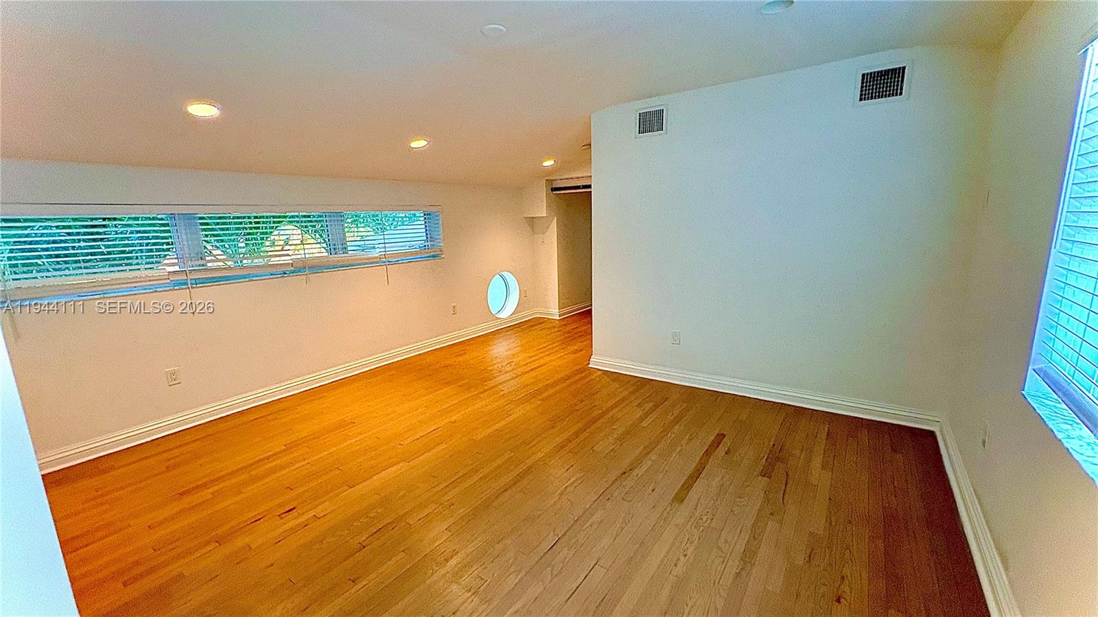 2301 South Miami Avenue Miami, FL 33129 - Photo 11 of 68 a view of empty room with wooden floor and fan
