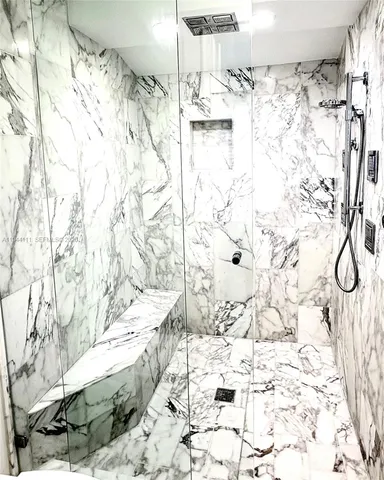 a view of the patio with a table and chairs under an umbrella