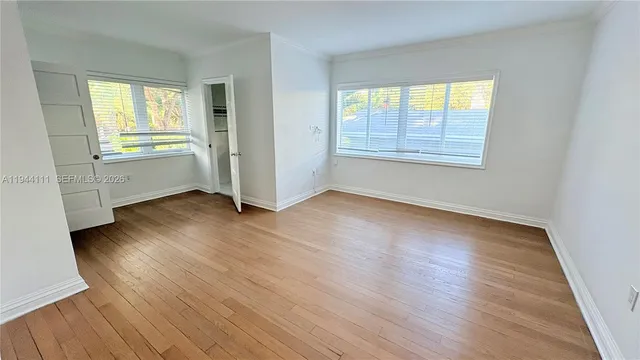 a living room with furniture fireplace and a large window