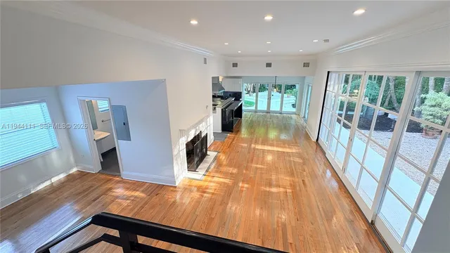 a kitchen with kitchen island a counter top space a sink and a refrigerator