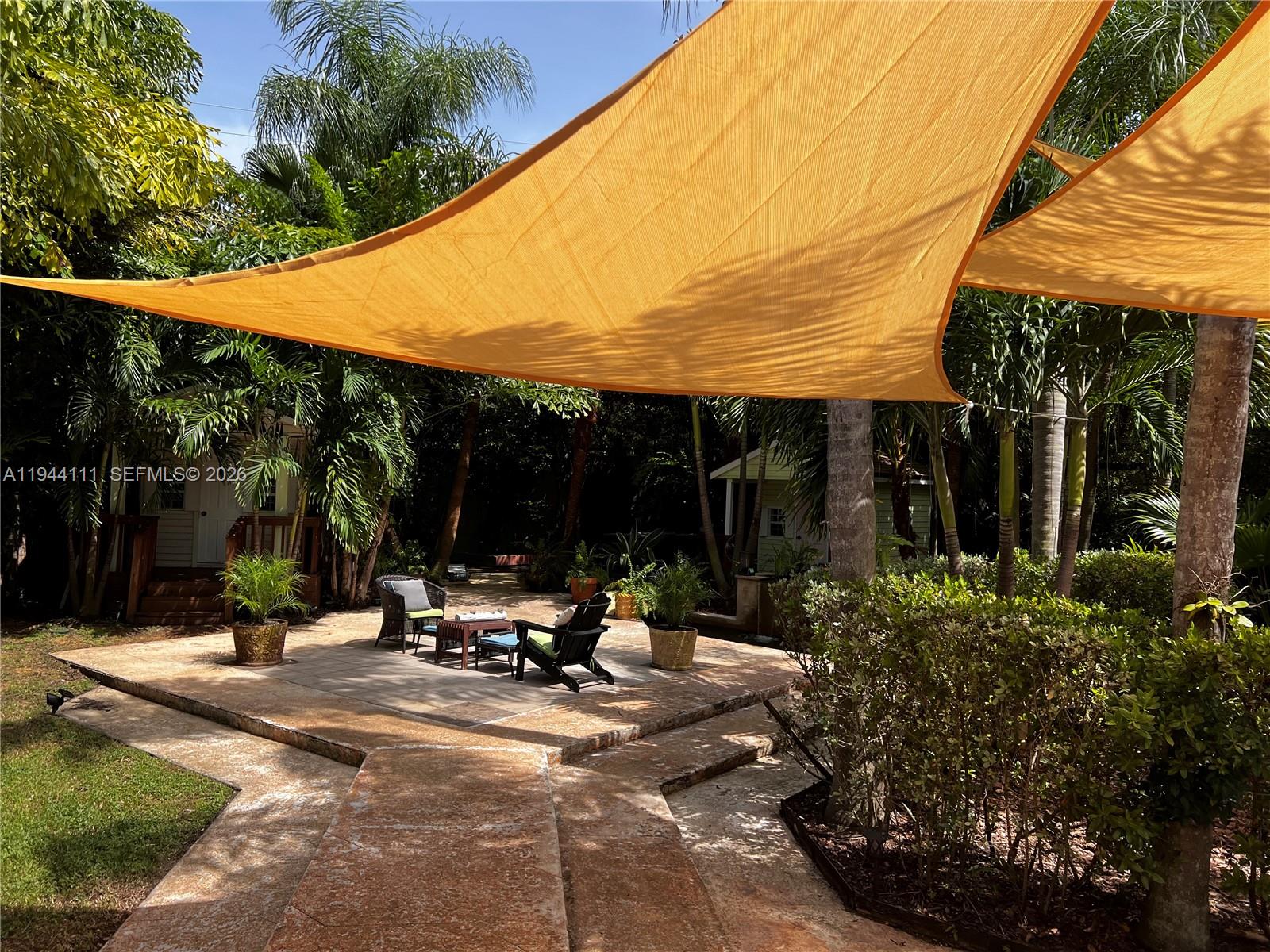 2301 South Miami Avenue Miami, FL 33129 - Photo 45 of 68 a view of the patio with a table and chairs under an umbrella