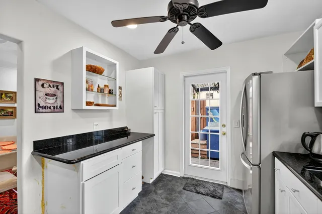 a kitchen with stainless steel appliances a stove sink microwave and cabinets