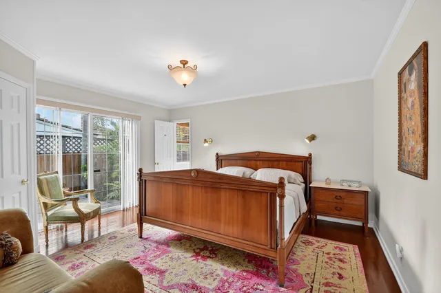 a bedroom with bed and a window