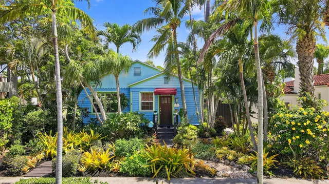 front view of a house with a tree