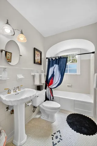 a utility room with stainless steel appliances granite countertop lots of wooden furniture