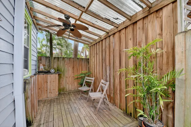 a view of balcony with wooden floor and furniture