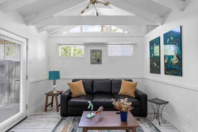 a bedroom with bed and window