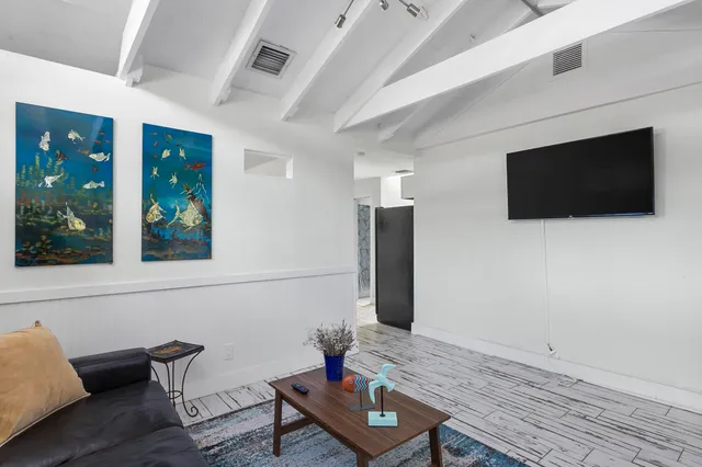 a bedroom with a bed and a couch