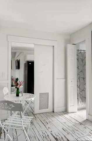 a bathroom with a toilet and a shower