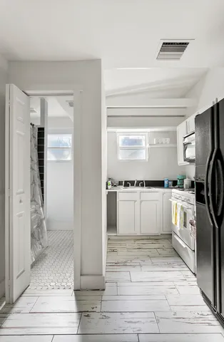 a view of a livingroom with a flat screen tv