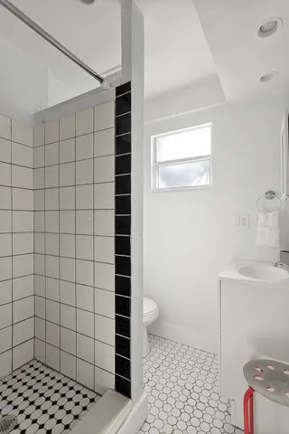 a bathroom with a sink toilet and vanity