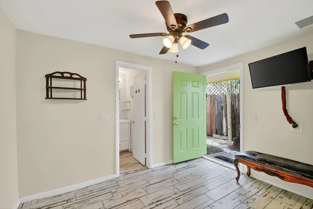 a view of an house with backyard and sitting area