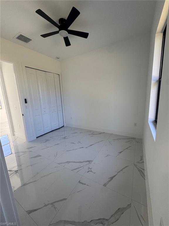 1127 Chipley Street Lehigh Acres, FL 33974 - Photo 5 of 8 a view of a storage & utility room