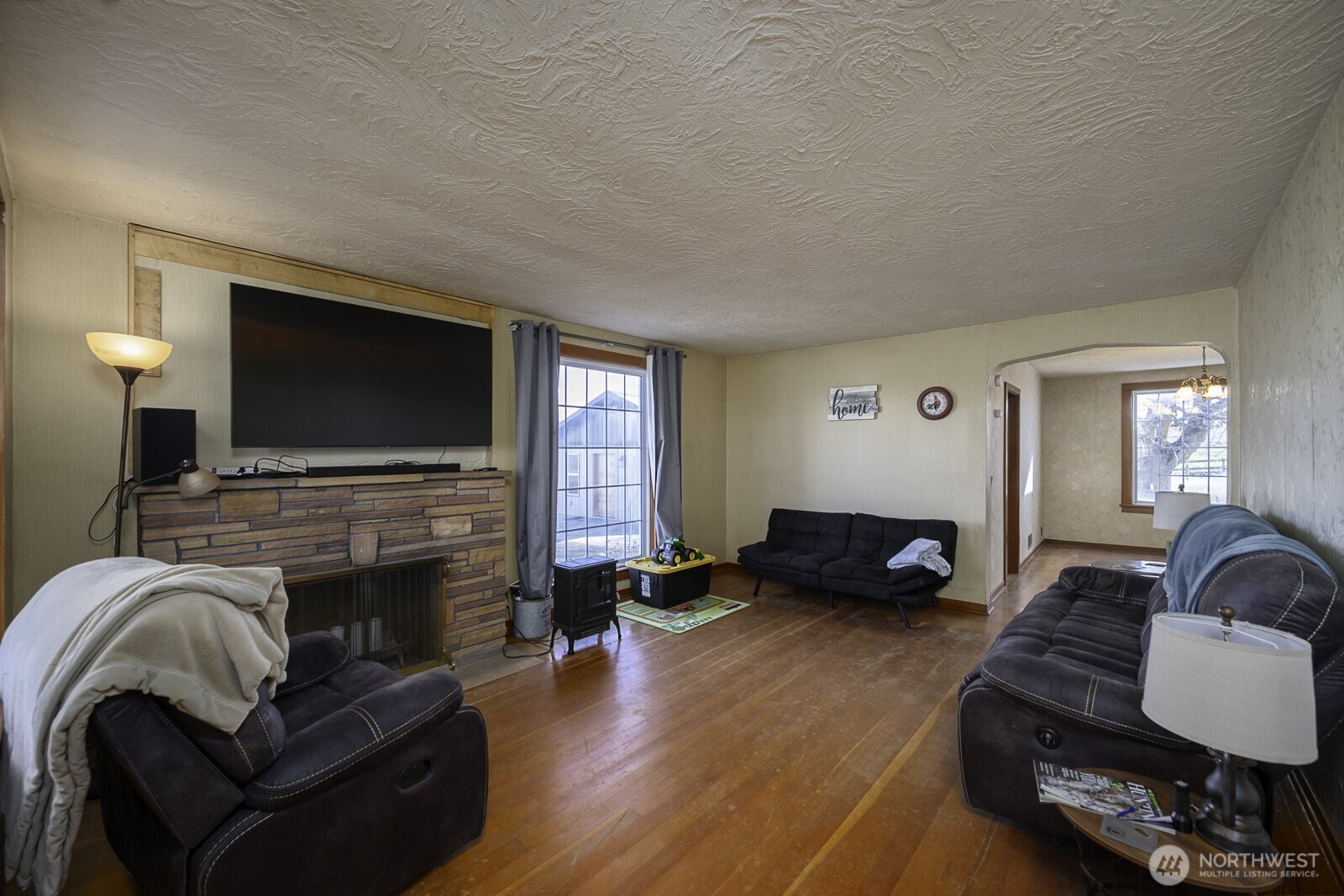 32244 Mohler Road East Mohler, WA 99154 - Photo 13 of 35 a living room with furniture and a flat screen tv