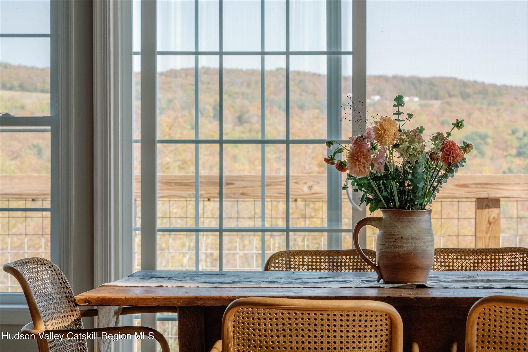 321 Mutton Hill Road Neversink, NY 12765 - Photo 11 of 25 a living room with furniture and a potted plant