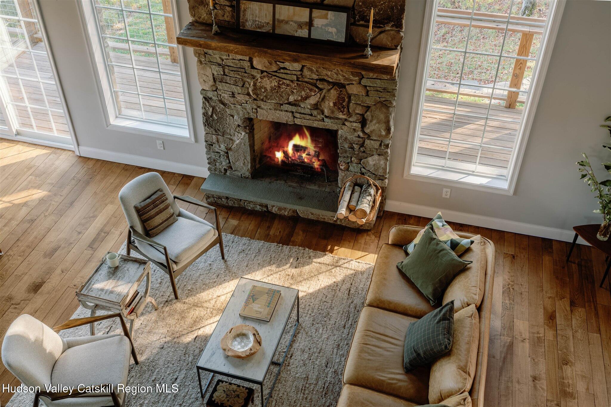 321 Mutton Hill Road Neversink, NY 12765 - Photo 16 of 25 a living room with furniture and a fireplace